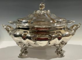 A William IV Old Sheffield plate fluted oval soup tureen and cover, in the Rococo Revival taste, bud