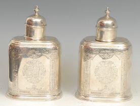 A pair of early George II silver oval tea caddies, bell-shaped push-fitting covers, flat-chased with