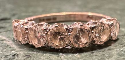 A diamond half eternity ring, linear set with seven round brilliant cut diamonds, total estimated