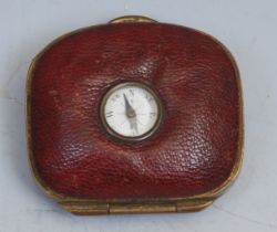 An unusual 19th century red leather coin purse, set with a compass, 5cm wide