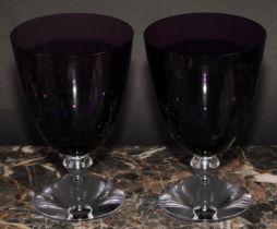 A pair of Baccarat crystal Vega wine glasses, purple bowls, clear knopped stems, domed circular