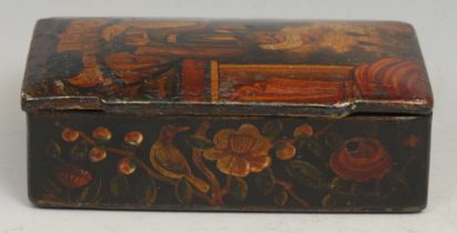 A Persian papier-mâché rectangular snuff box, hinged cover decorated with a figure of the court,