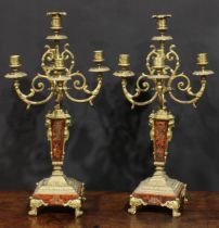 A pair of 19th century gilt metal and simulated Boulle five-light candelabra, in the baroque