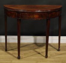 A George III mahogany demilune card table, hinged top with moulded edge enclosing a baize lined