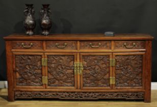 A Chinese hardwood side cabinet, rectangular top above four drawers and four panel doors, each