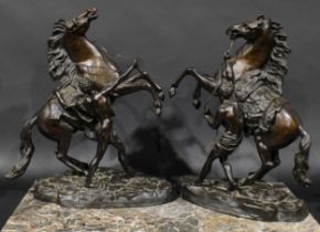 After Guillaume Coustou the Elder (19th century), a pair of dark patinated bronzes, The Marly