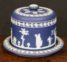 A Wedgwood Jasperware cheese dome, sprigged in white after the antique, within bands of fruiting