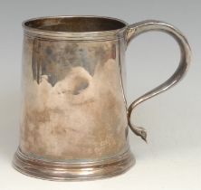 A Queen Anne silver mug, quite plain, S-scroll handle, reeded rim, skirted base, 11cm high, London