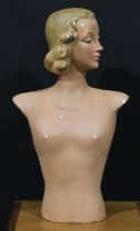 A mid-20th century French plaster shop display advertising model, of an Art Deco female, inscribed