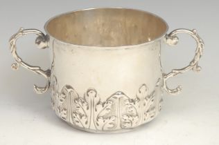 A Charles II silver porringer, chased with a band of acanthus, leafy scroll handles, 15cm wide, John
