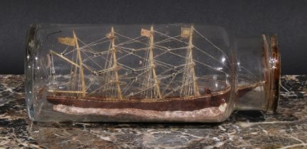 Folk Art - a ship in a bottle, early 20th century, 22cm long