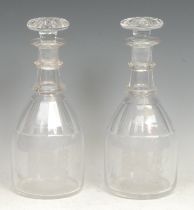 A pair of 19th century mallet shaped decanters, each etched with a ship in full sail, 26cm high, c.