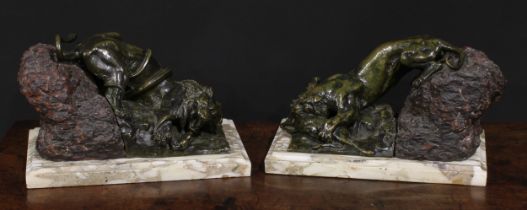 Continental School, 19th century, a pair of patinated bronze and stone sculptures, Combat, a lion in