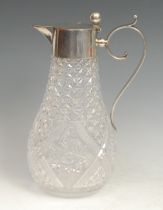 A Continental silver mounted hobnail cut glass claret jug, hinged cover with ball thumbpiece,