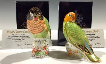A pair of Royal Crown Derby paperweights, Black Faced Lovebird and Red Faced Lovebird, limited