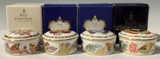 A set of four Royal Crown Derby Butterflies of The World circular trinket pots and covers,