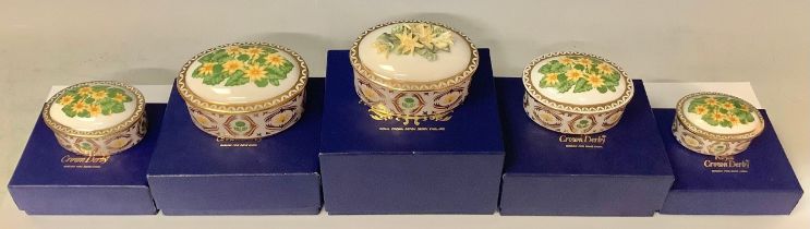 A set of five Royal Crown Derby Celandine pattern graduated oval trinket dishes and covers, the