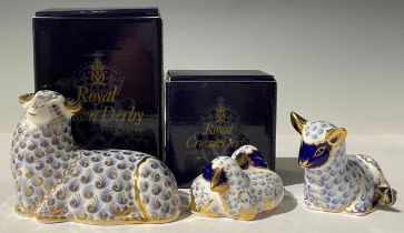 A Royal Crown Derby paperweight family group, comprising Sheep, Lamb and Twin lambs, gold