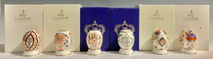 A set of six Royal Crown Derby Eggs of The World, comprising Italian, English, Greek, Japanese,