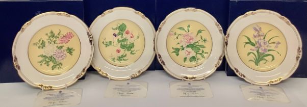 A matched set of four Royal Crown Derby shaped circular plates, reproduced from archive watercolours