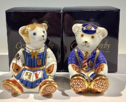 A pair of Royal Crown Derby paperweights, Schoolgirl Teddy and Schoolboy Teddy, gold stoppers,