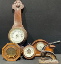 An Edwardian walnut mantel clock. arched case, inlaid with boxwood and ebony stringing, white dial