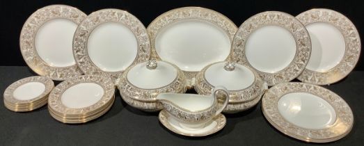 A Wedgwood Gold Florentine pattern dinner service, comprising pair of vegetable dishes and covers,