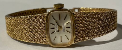 A lady's Rotary 9ct gold watch, rounded rectangular silvered dial, baton indicators, integral 9ct