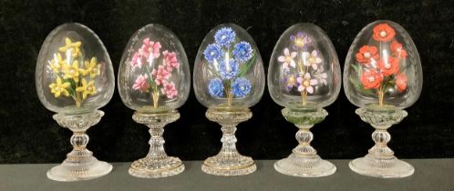 A set of five Franklin Mint House of Faberge clear glass pedestal eggs, each with an enamel floral