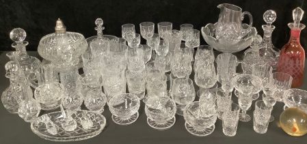 Glassware - a pair of cut glass stoppered decanters, a cranberry overlay cut stoppered decanter;
