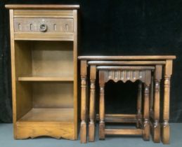 A 20th century oak nest of three occasional tables, the tallest 48cm high; a similar oak side table,