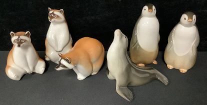 A pair of Russian Lomonosov porcelain penguins; others, raccoons, seal (6)