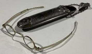 An Edwardian chatelaine spectacle case, containing a pair of Georgian extendable spectacles (2)