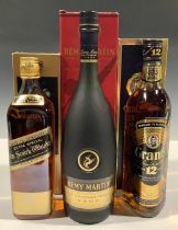 A bottle of Johnnie Walker Black Label Extra Special Old Scotch Whisky, 75cl, boxed; a bottle of