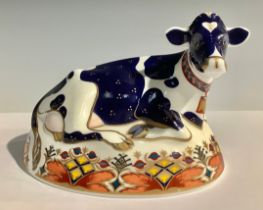 A Royal Crown Derby paperweight, Friesian Cow Buttercup, silver stopper, 16cm wide, printed mark