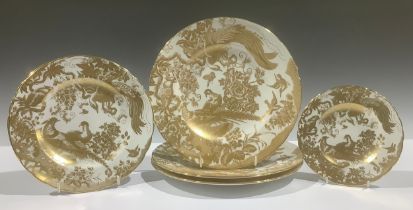 A Royal Crown Derby Aves Gold pattern dinner plate, two others, pair of dessert plates, a tea plate,