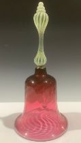 A large Victorian cranberry glass bell, uranium and opaque glass twist handle, wrythen glass bell