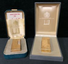 Two gold plated Dunhill lighters, in original boxes