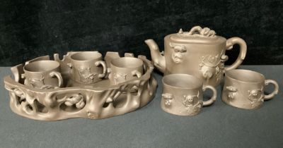 A Chinese Yixing seven piece tea set, decorated with squirrels, character mark (7)