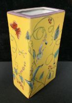 A Chinese slab sided vase, painted in bright enamels with insects, butterflies and trailing foliage,