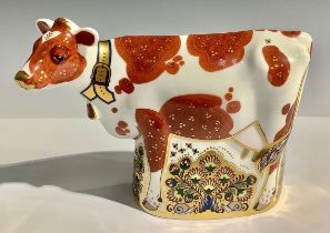 A Royal Crown Derby paperweight, Daisy Cow, gold stopper, 15cm high, printed mark in red