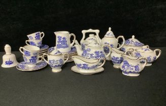 A Coalport miniature Willow pattern tea and dinner service, printed in blue and white, comprising