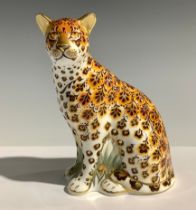 A Royal Crown Derby paperweight, Leopardess, 13cm high, silver stopper and red printed marks to