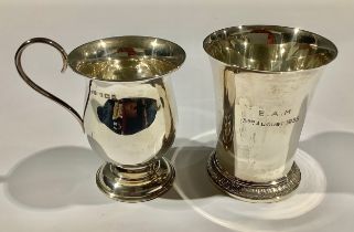A George V silver flared beaker, spreading cylindrical foot with stiff leaves, 8cm high, London