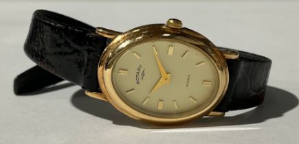 A lady's Rotary 9ct gold watch, oval dial, baton indicators, marked 375, black leather strap, boxed