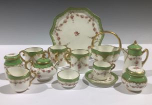 A Coalport miniature tea service, comprising teapot, coffee pot, cream jug, sugar bowl, tea cup