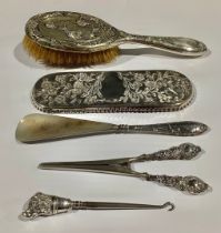 A Victorian silver pen tray, embossed in the Aesthetic manner with flowers and butterflies, 21.5cm
