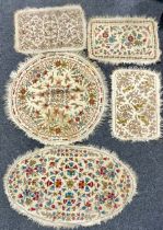 An Indian Namdha felt circular rug or carpet, embroidered with colourful threads with stylised birds