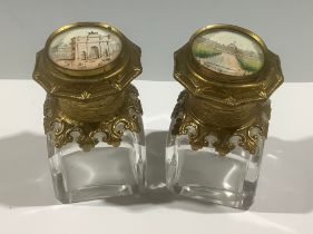 A pair of late 19th/early 20th century French "Grand Tour" souvenir scent bottles, the gilt brass