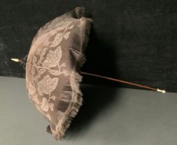 A late 19th/early 20th century parasol, the Malacca cane with turned and carved bone knop and